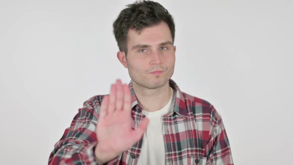 Portrait of Young Man Showing Stop Sign