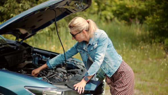 Auto Failure Accident Inspection Oil Level.Frustrated Girl Repairing Damage Car.