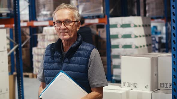 Portrait of caucasian mature man in warehouse. Shot with RED helium camera in 8K.