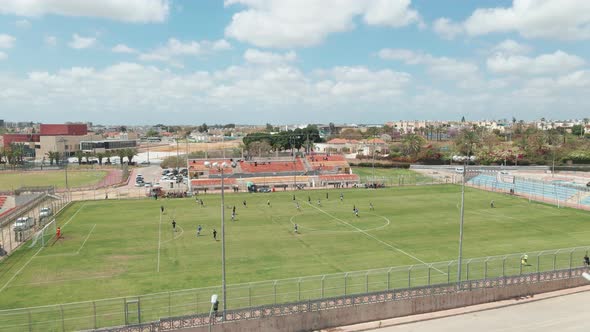 soccer game at noon shot from above