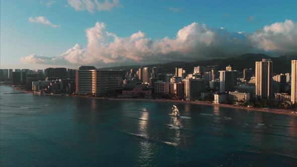 Aerial drone footage of Honolulu, Hawaii. Beautiful real estate, buildings in the city. Palm trees