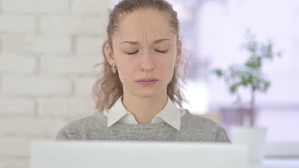 Tired Young Latin Woman Having Headache in Office