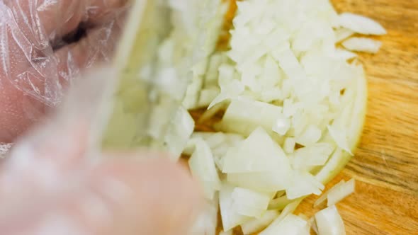 The Chef Professionally Cuts Onions with a Knife