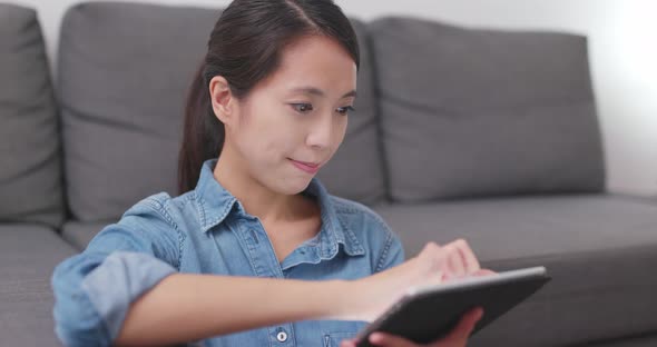 Woman watching tablet computer