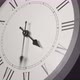 Latin Clock Face In Time Lapse On Dark Grey Wall  - VideoHive Item for Sale