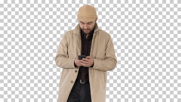 Young Handsome Man in Cloak Messaging with Phone, Alpha Channel