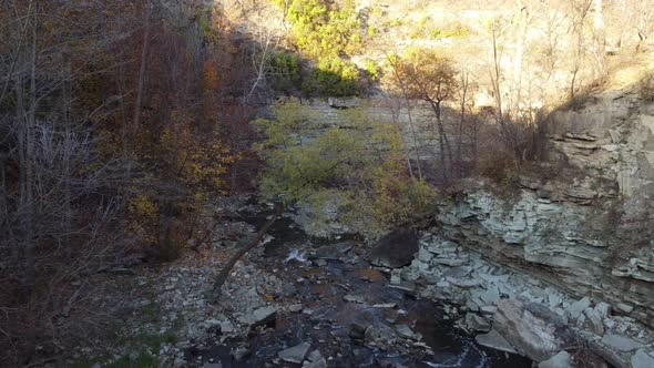 Wilderness beautiful landscape aerial dolly in shot capturing the sediment formation and spring wate