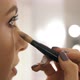 A professional makeup artist puts on eye shadow - VideoHive Item for Sale
