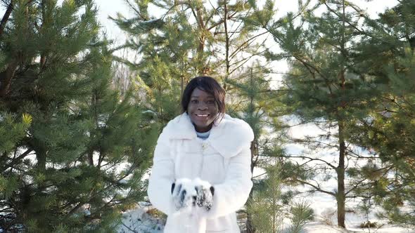 Woman Throws Up Snow Posing at Photo Session in Winter Park