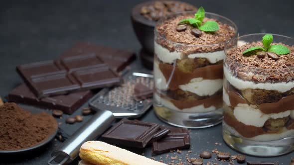 Classic Tiramisu Dessert in a Glass on Dark Concrete Background