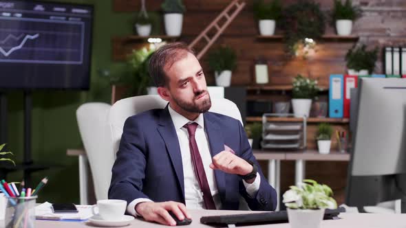 Businessman Reading an Important Email Happily Reacts