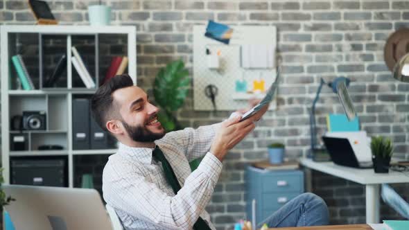 Slow Motion of Happy Entrepereneur Throwing Cash Laughing Having Fun in Office