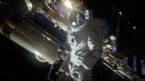 Astronaut Outside the International Space Station on a Spacewalk alt