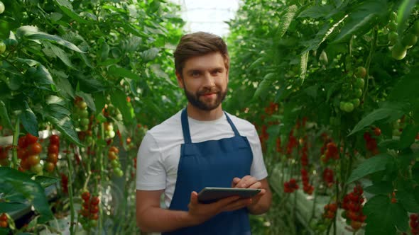 Man Farmer Collecting Cultivation Research Modern Device in Big Plantation