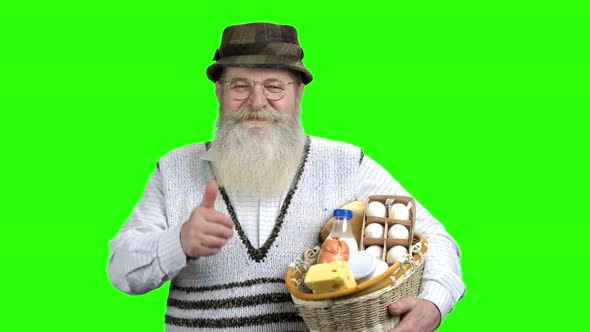 Portrait of Happy Farmer Holding Basket of Dairy Products