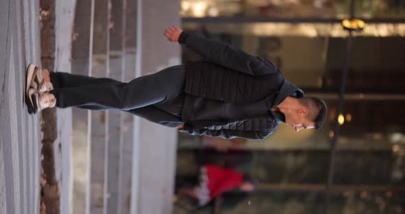 Man in Grey Costume Cross the Road in a City Vertical Video