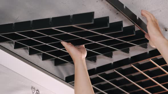 Male Workers Installing Panels for Open Cell Ceiling