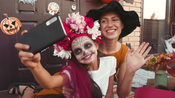 Happy Woman and Kids Taking Selfie on Halloween