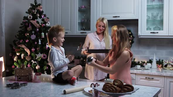 Family Christmas  Mother and Her Children Making Desserts