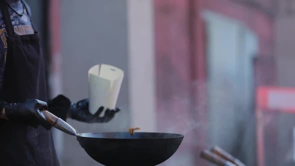 Street Food. Chef Cooking Thai Meal In Wok On Fire Outdoors