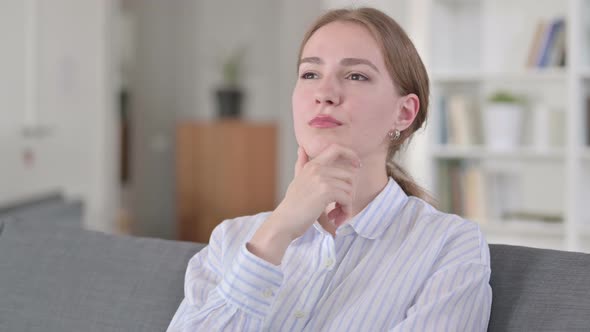 Portrait of Pensive Young Woman Thinking 