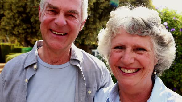 Senior couple standing in garden