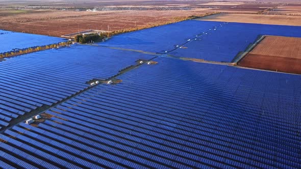 Large Field of Blue Photovoltaic Solar Panels. Aerial View.