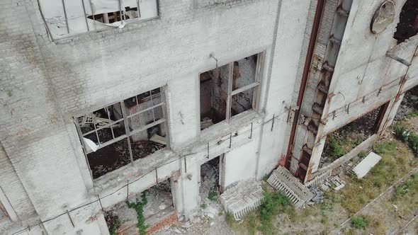 Aerial view of a destroyed factory during the war. Abandoned industrial building.