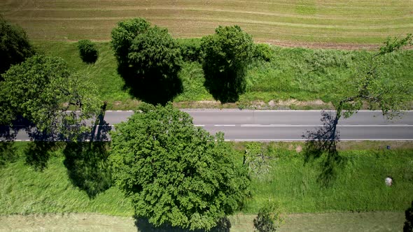 Long And Empty Public Road In The Middle Of The Agricultural Grassland In Warmia-Mazury Province, Po