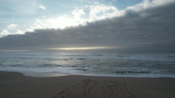 Aeral view of beach and sea with rain clouds