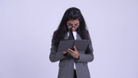 Young Shy Persian Businesswoman Covering Face with Book