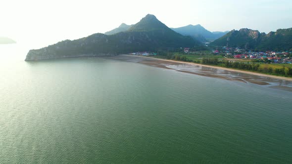 A fishing village amidst the beautiful coastline of Thailand. Mountains on the coast of the sea.