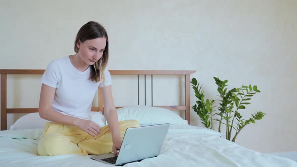 Woman Using Laptop, Sitting in Bed, Celebrating Success, Online Lottery Win, Reading Good Message