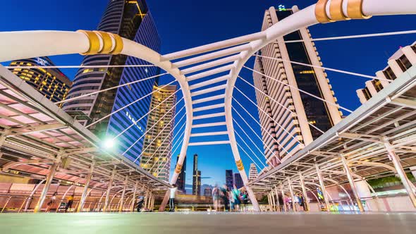 day to night time lapse of Chong Nonsi skytrain station in Bangkok,  Thailand