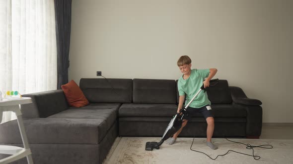 Nine Year Boy Having Fun While Cleaning