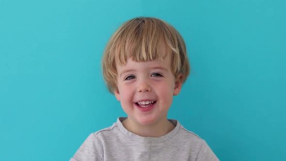 Little Boy Laughing at Camera