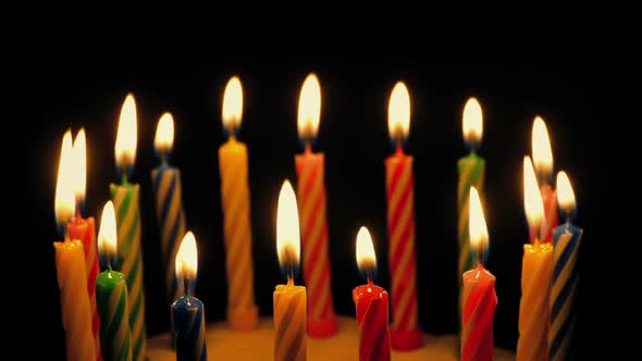 Candles Blown Out On Cake In Dark Room