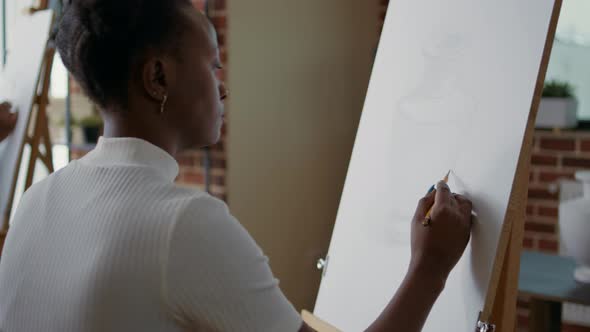 Young Student Creating Vase Masterpiece at Art Workshop