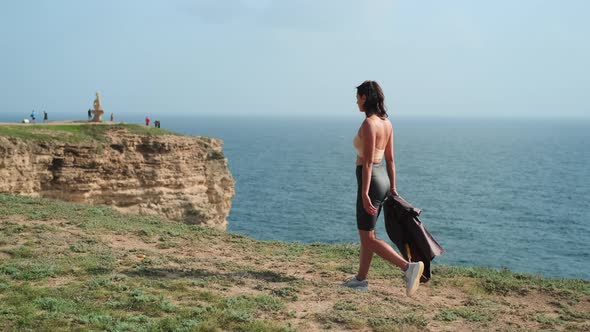 Sexy Woman is Visiting Natural Landmark on High Seacoast