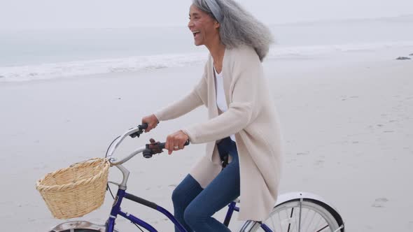 Mature woman enjoying time outside by the sea