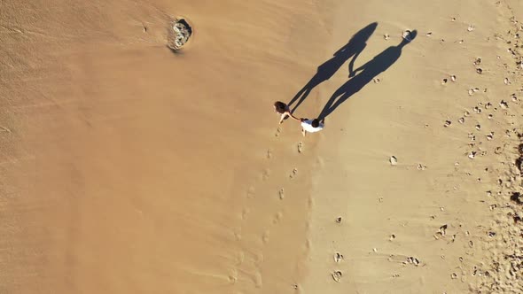 Two people tanning on perfect sea view beach wildlife by blue ocean and clean sand background of Gil