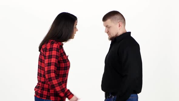 Woman Shouts at the Man, Pushing and Beating His Chest. White