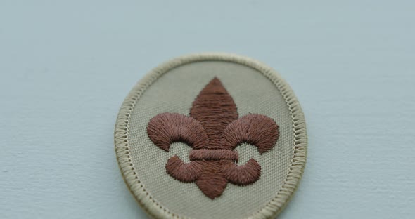 Close Up Tilt Down of a Boy Scout Arm Patch