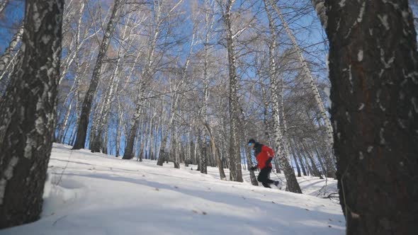 Man Running at the Mountain with Snow