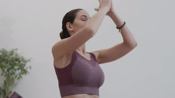 Young Sportswoman Doing Yoga Exercises