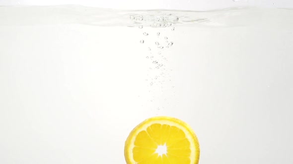 Parts of the Lemon and Water Splash in Slowmotion