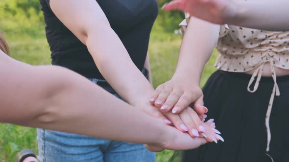 Girls Friends Join Hands in the Park