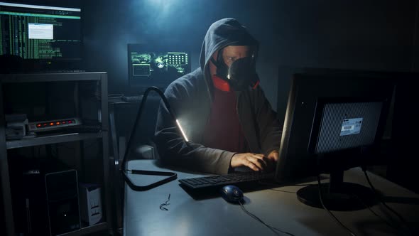 Bio-Terrorist types in computer code wearing a gas mask.