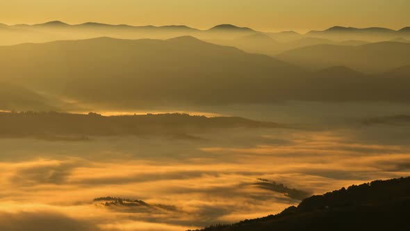 Time Lapse Fog Floating In Mountain Valley During Golden Hour