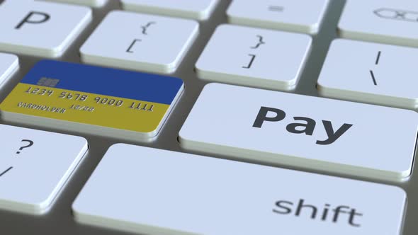 Bank Card Featuring Flag of Ukraine As a Key on Keyboard alt